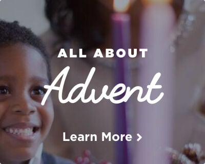 Child gazes at Advent candle on a wreath, decorated with greenery & berries. Candle glow illuminates child's face. Image links to Advent page.